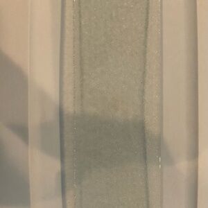 12 3/4 12/16 in long x 3 3/4 12/16 in deep Tempered glass Shelf a vanity cabinet